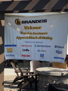 KTSU America sponsored logo on Brandies welcome banner for the Brandeis customer Appreciation Golf Outing