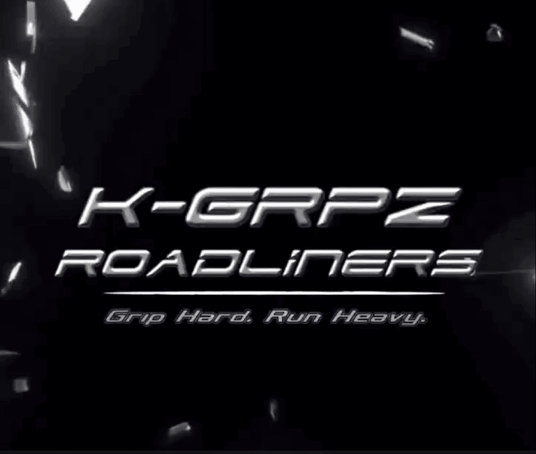Image of text showing title K-GRPZ Roadliners with tagline Grip Hard. Run Heavy. with a black background with broken bits of glass in the distance.