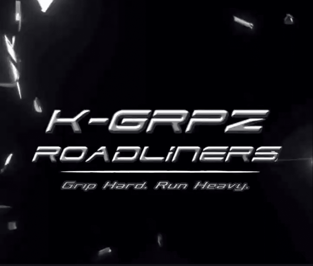 Image of text showing title K-GRPZ Roadliners with tagline Grip Hard. Run Heavy. with a black background with broken bits of glass in the distance.